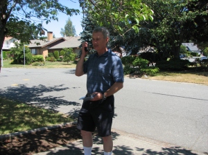 Mr. Joe Baxter helped with the leaflet drop. Here he is with the two-way radio checking the progress 